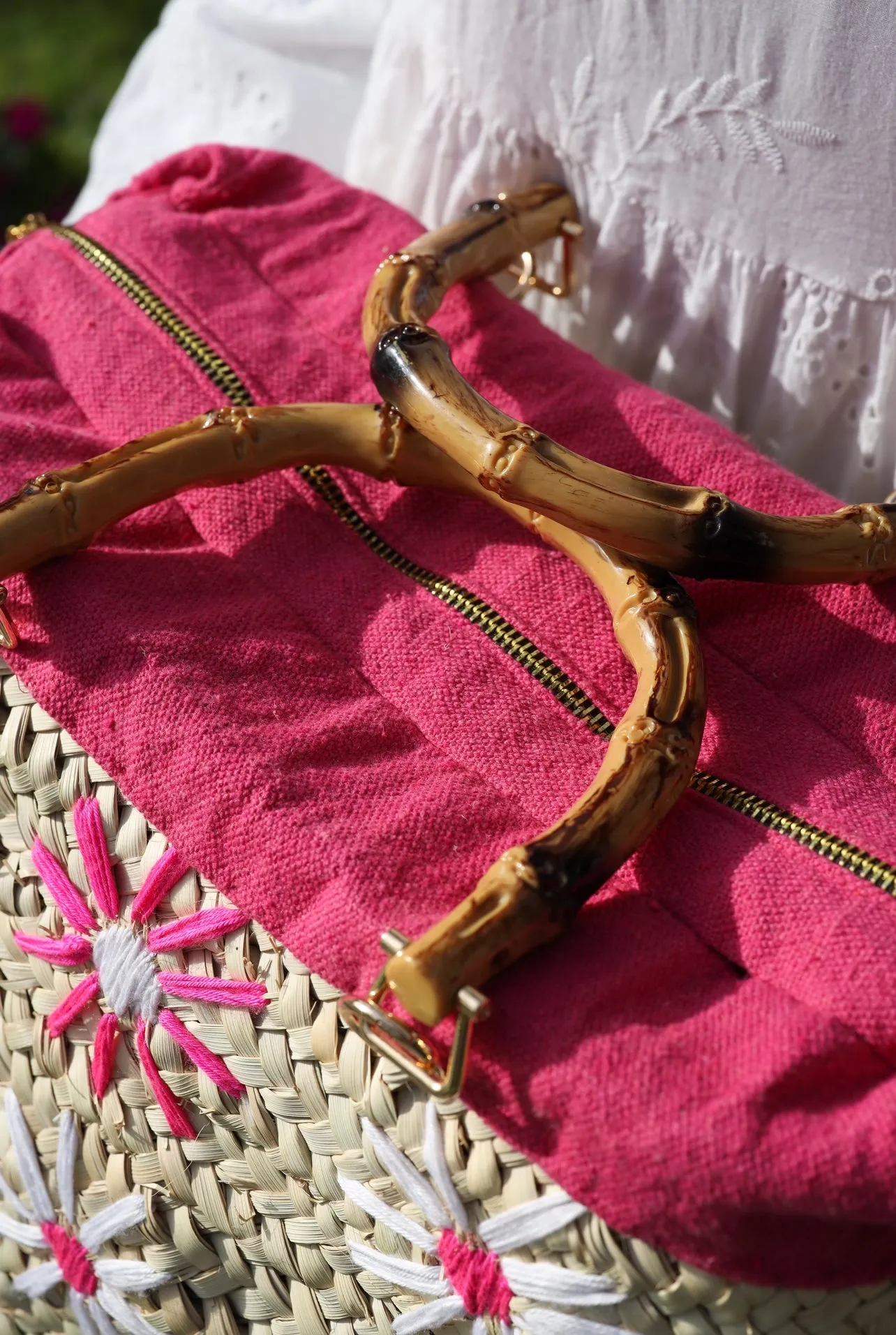 Fuschia embroidered wicker bag