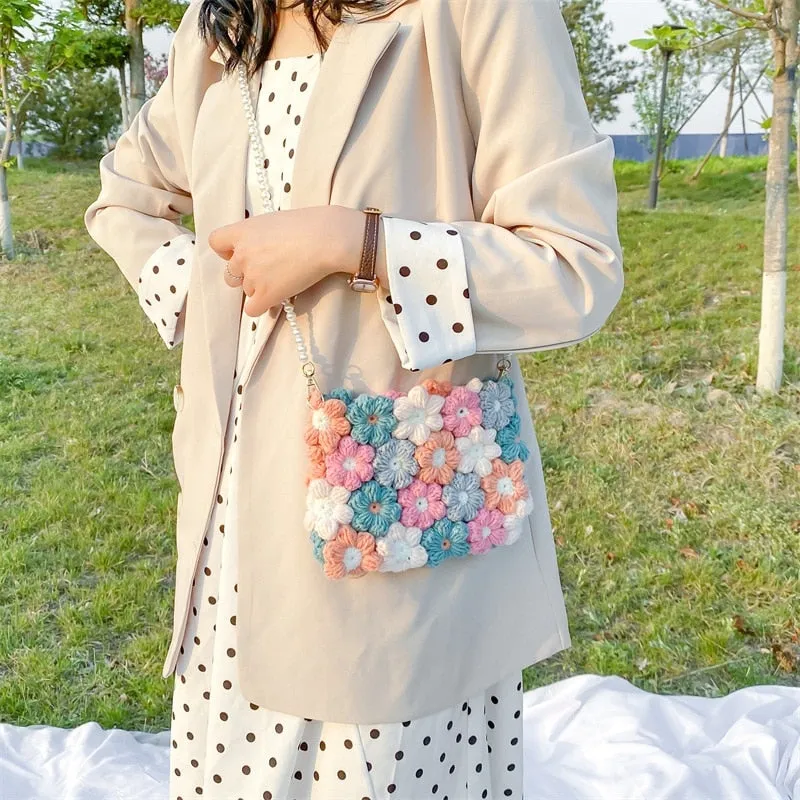 Hand woven woolen bag with puff flowers