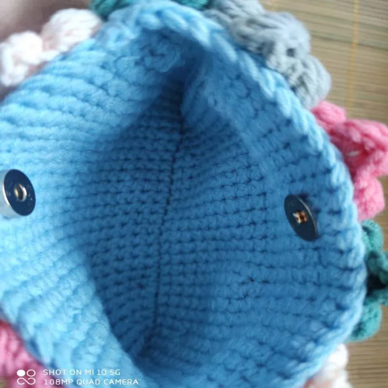 Hand woven woolen bag with puff flowers