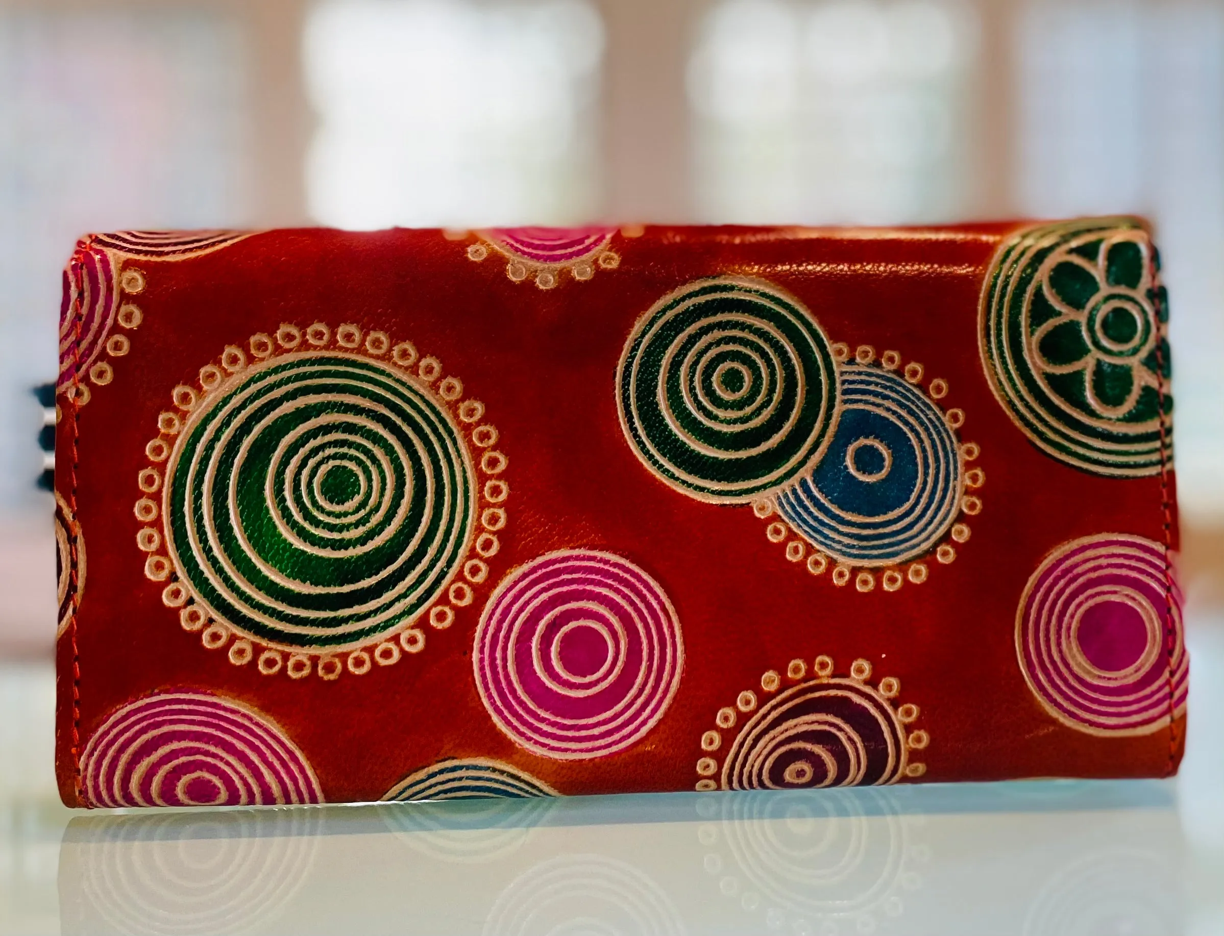LEATHER WALLET ORANGE TINTED BACKGROUND WITH PINK CIRCLES