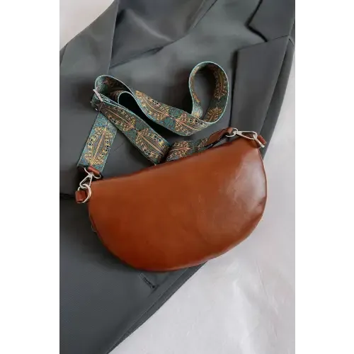 Stylish Leather Sling Bag with Unique Patterned Strap