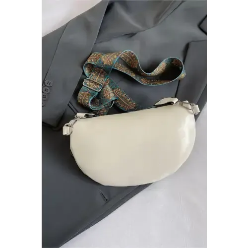 Stylish Leather Sling Bag with Unique Patterned Strap