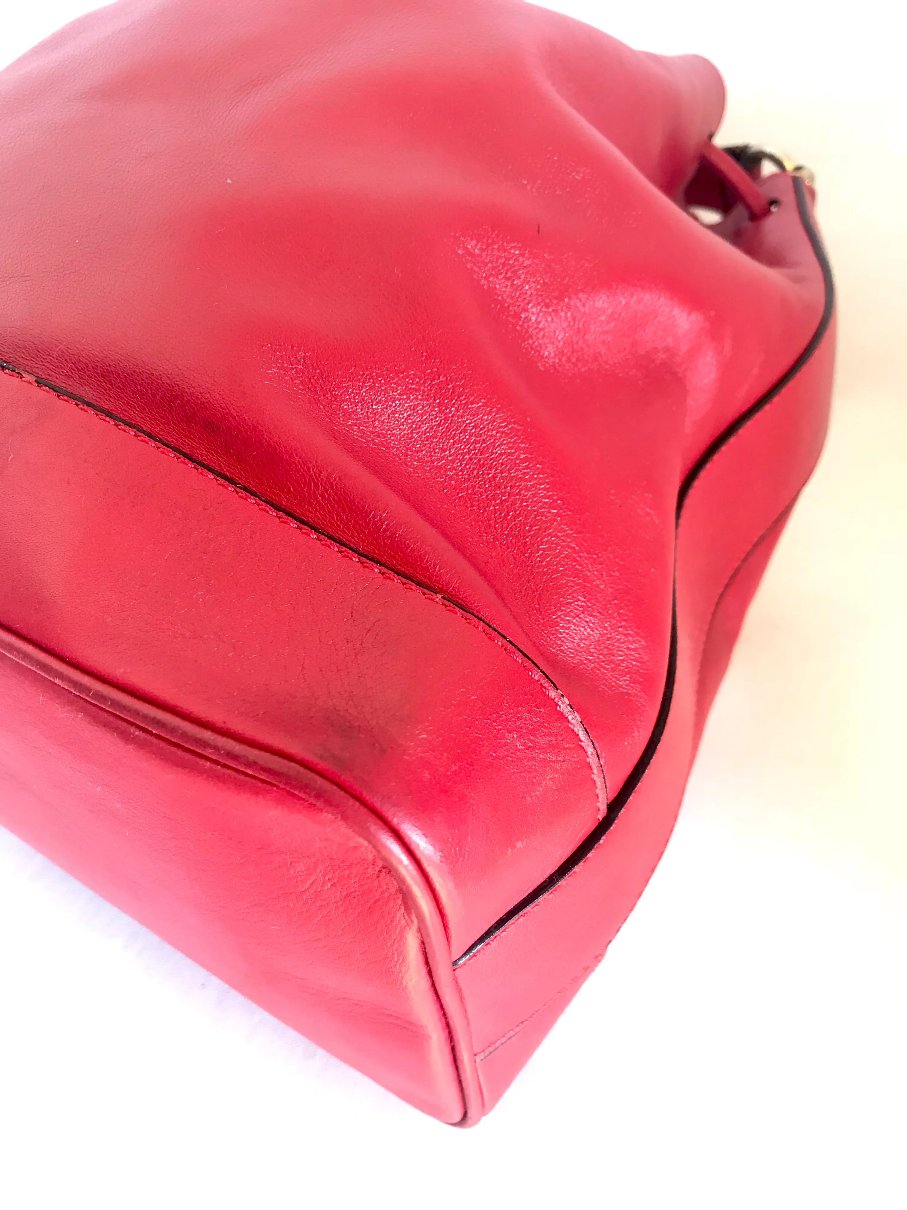 Vintage Celine red leather hobo bucket shoulder bag with a golden square logo motif and matching pouch. Classic drawstrings purse.