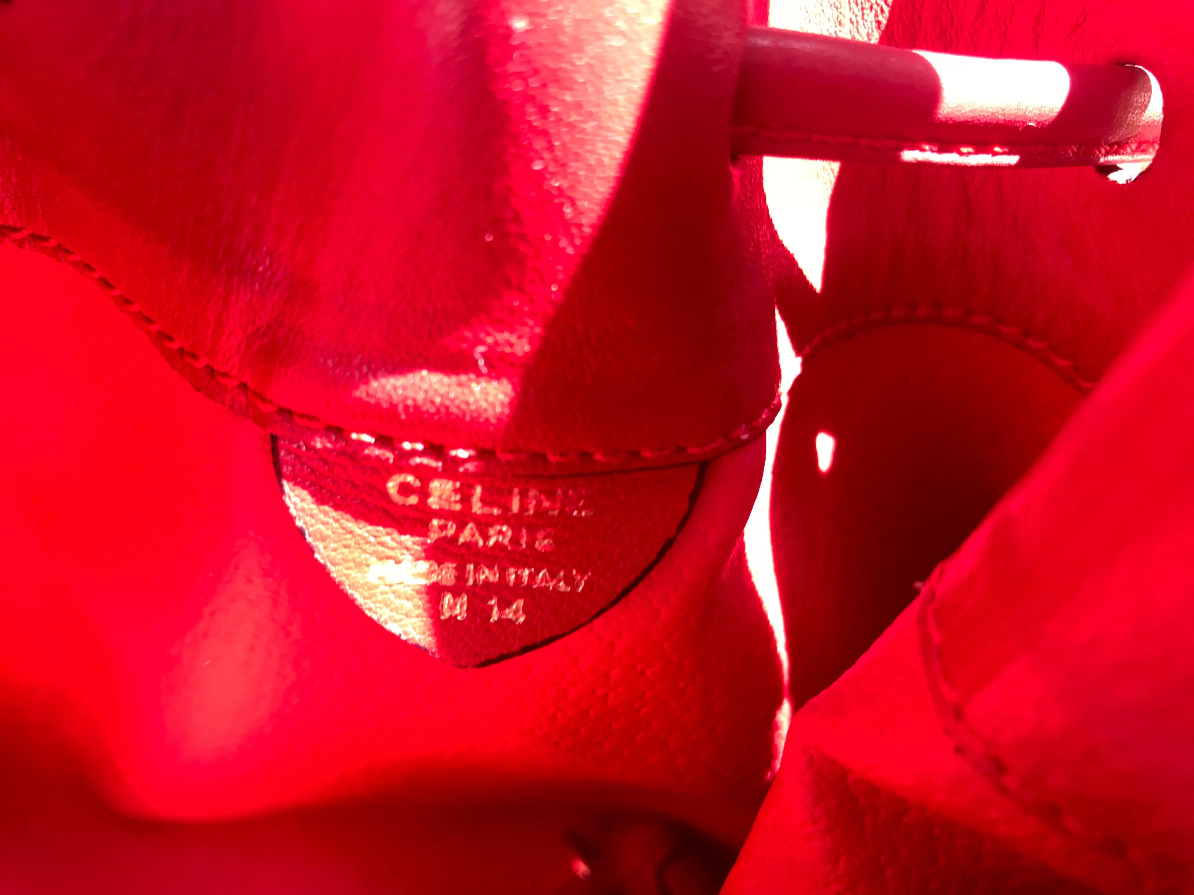 Vintage Celine red leather hobo bucket shoulder bag with a golden square logo motif and matching pouch. Classic drawstrings purse.