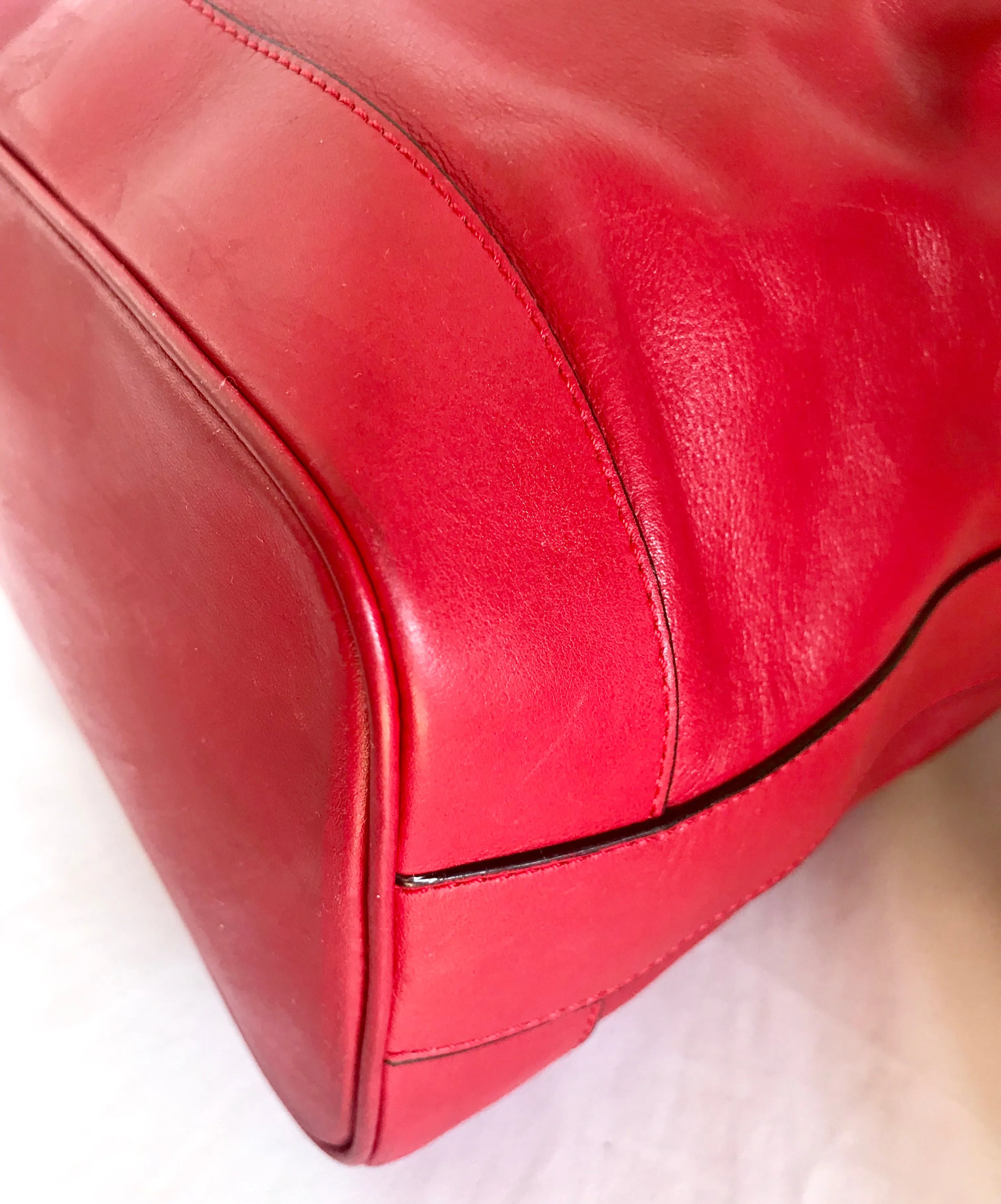 Vintage Celine red leather hobo bucket shoulder bag with a golden square logo motif and matching pouch. Classic drawstrings purse.