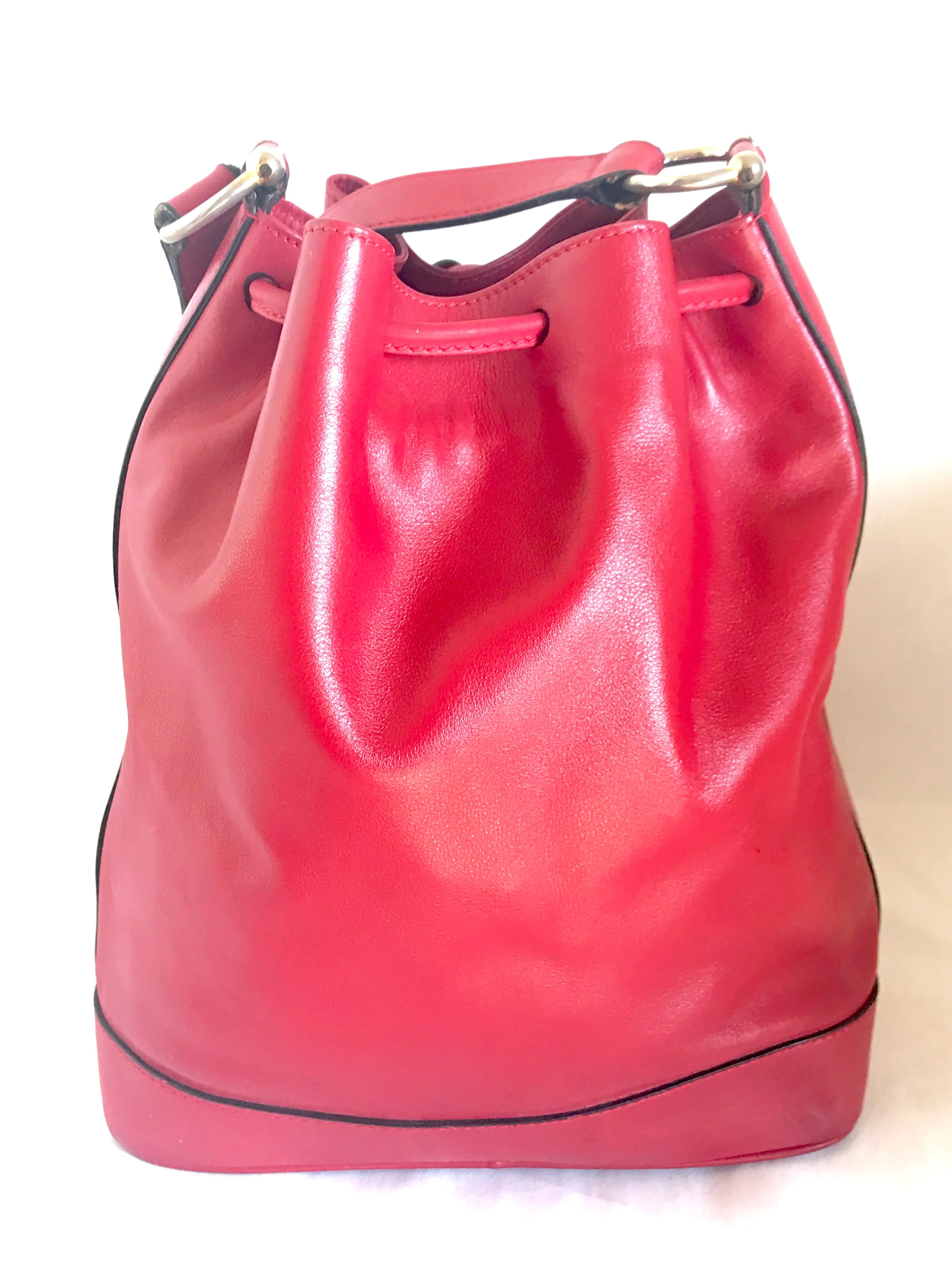 Vintage Celine red leather hobo bucket shoulder bag with a golden square logo motif and matching pouch. Classic drawstrings purse.